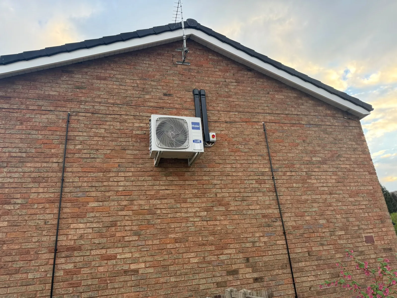 Air conditioning external condenser unit installed on a wall by Stret Limited, F-Gas certified installation in Staffordshire