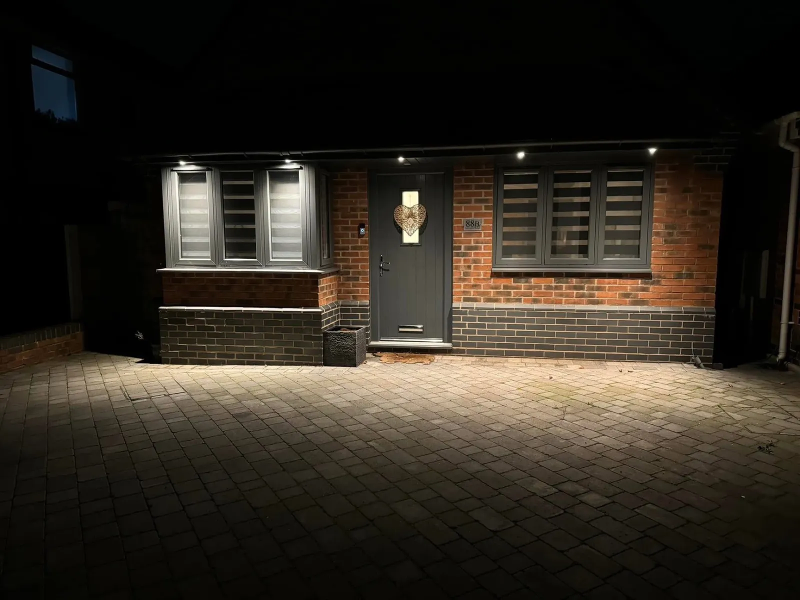 House frontage and driveway lit by exterior soffit lighting installed by Stret Limited electricians
