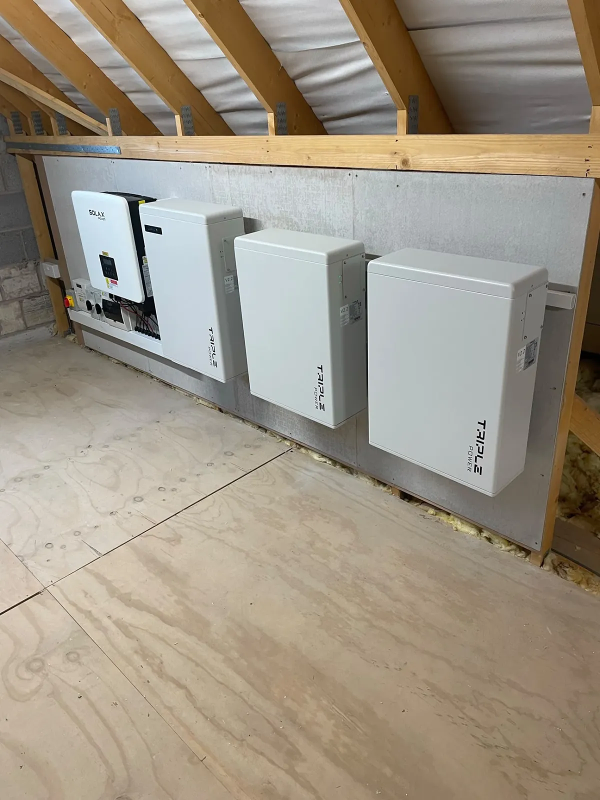 Solar battery storage and hybrid inverter installation mounted in a loft space