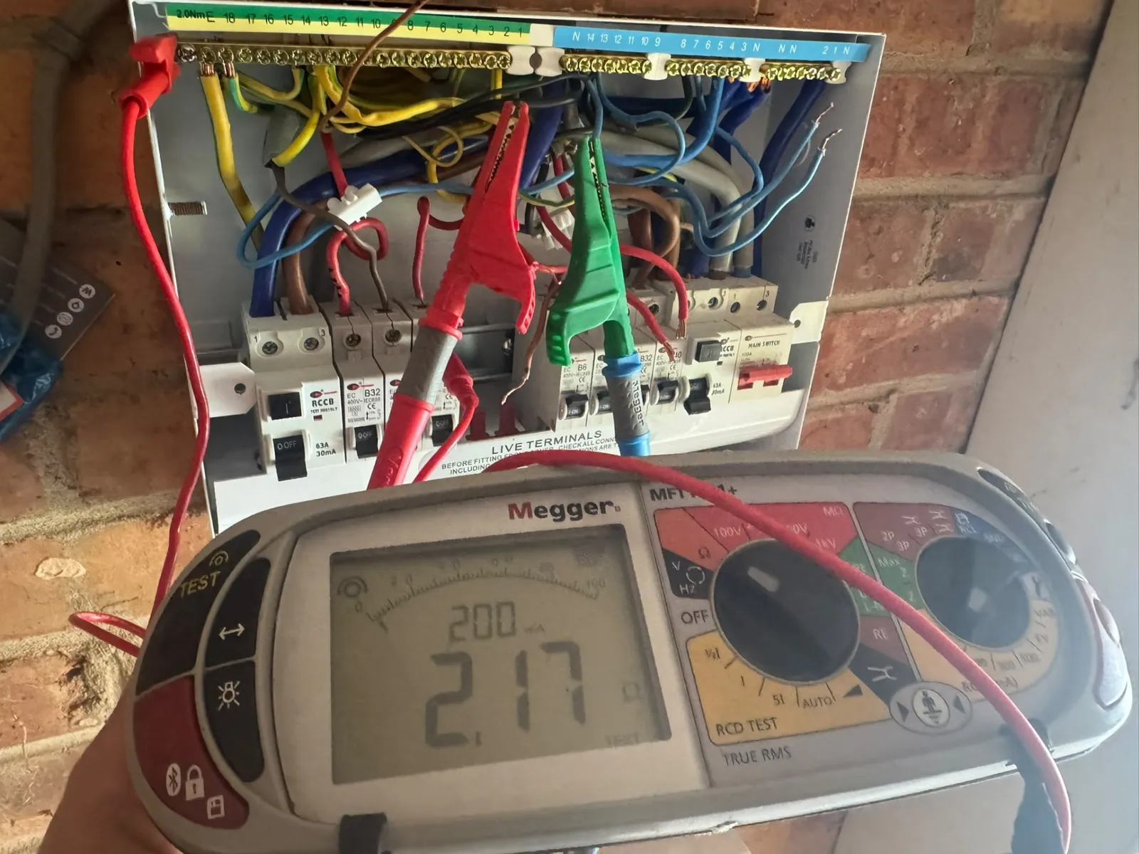 Electrical installation condition report in progress, test equipment connected to a consumer unit