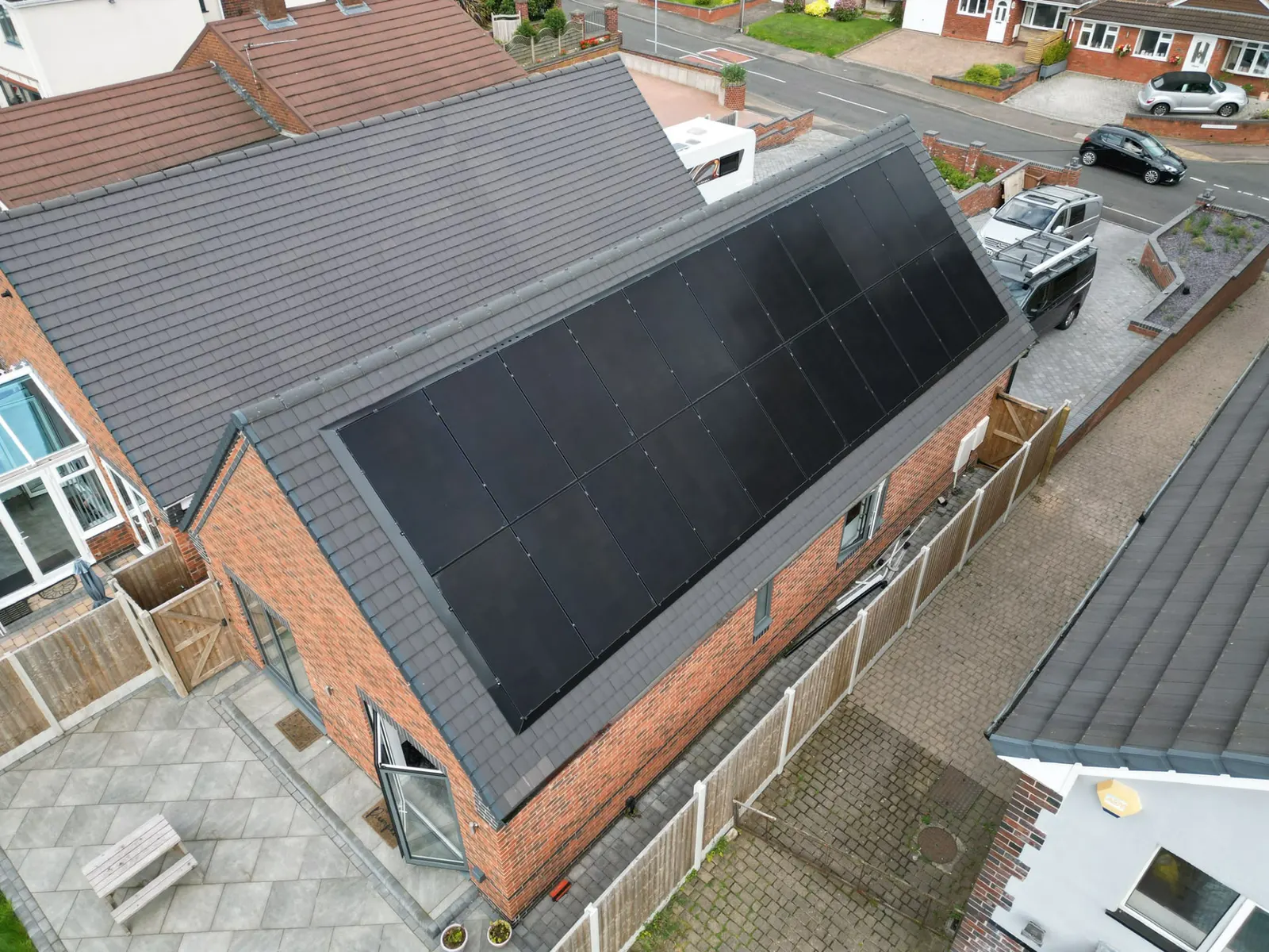 Aerial view of a full-roof solar panel array installed on a Staffordshire home by Stret Limited