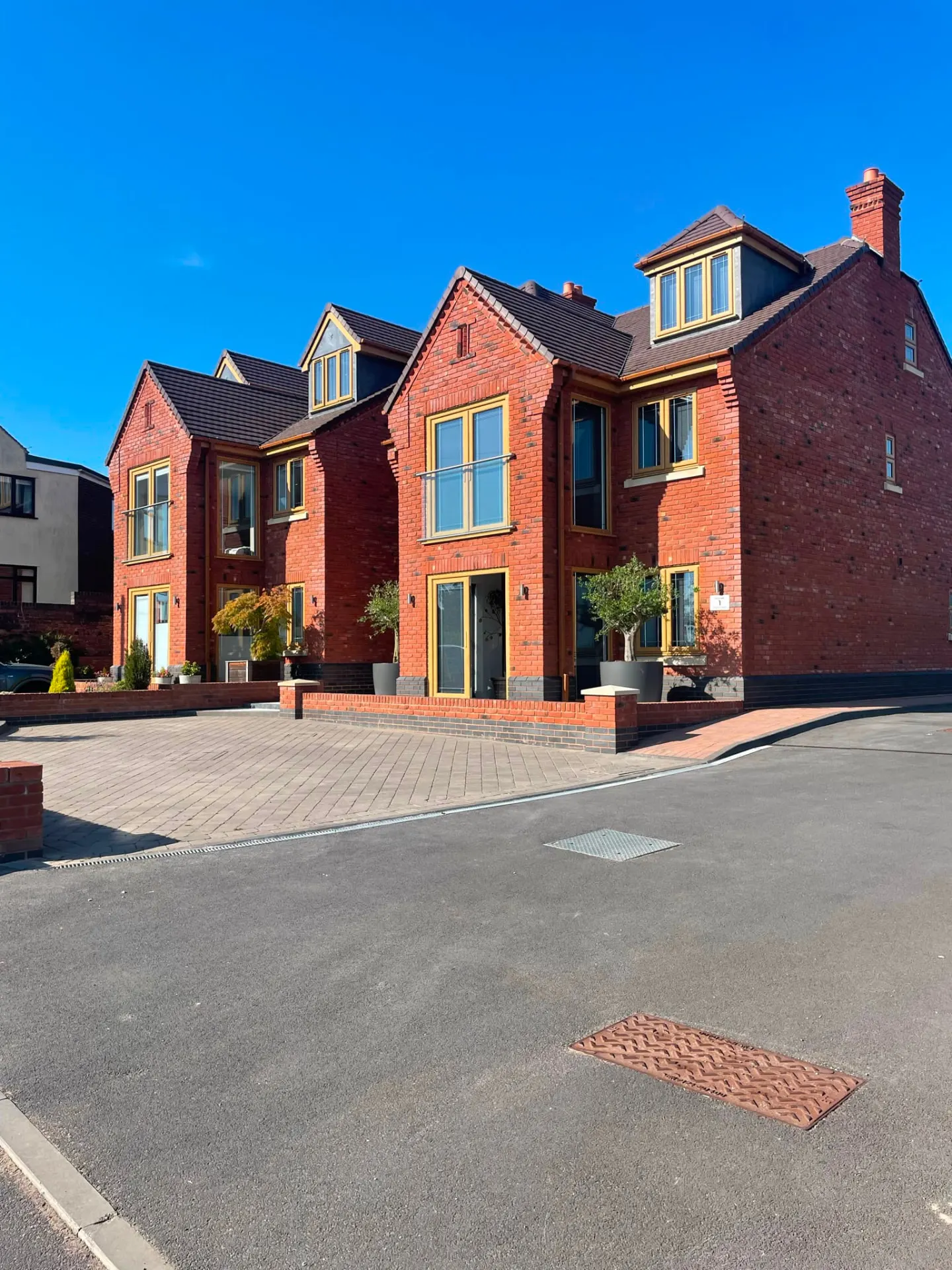 New build red brick houses with block paved frontage completed by Stret Limited in Burntwood