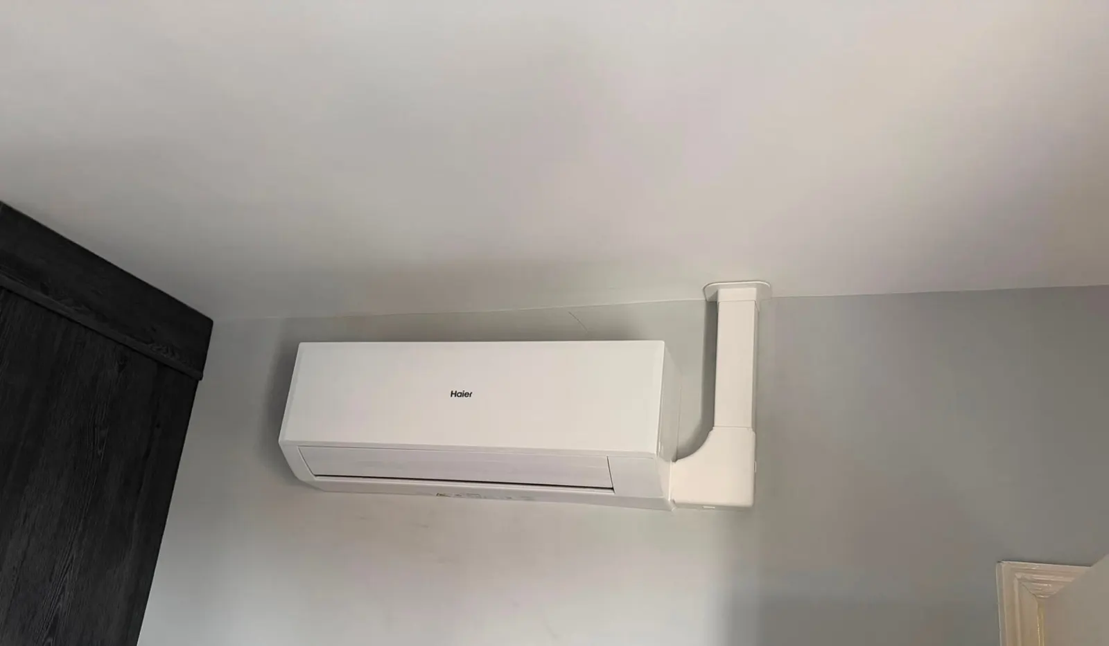 Haier wall-mounted air conditioning indoor unit installed with neat trunking by F-Gas certified installers in Staffordshire